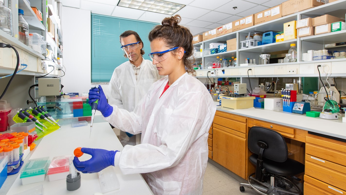 Professor Rick Russell (right) and graduate student Isabel Strohkendl conduct experiments using CRISPR enzymes. Image courtesy of The University of Texas at Austin.
