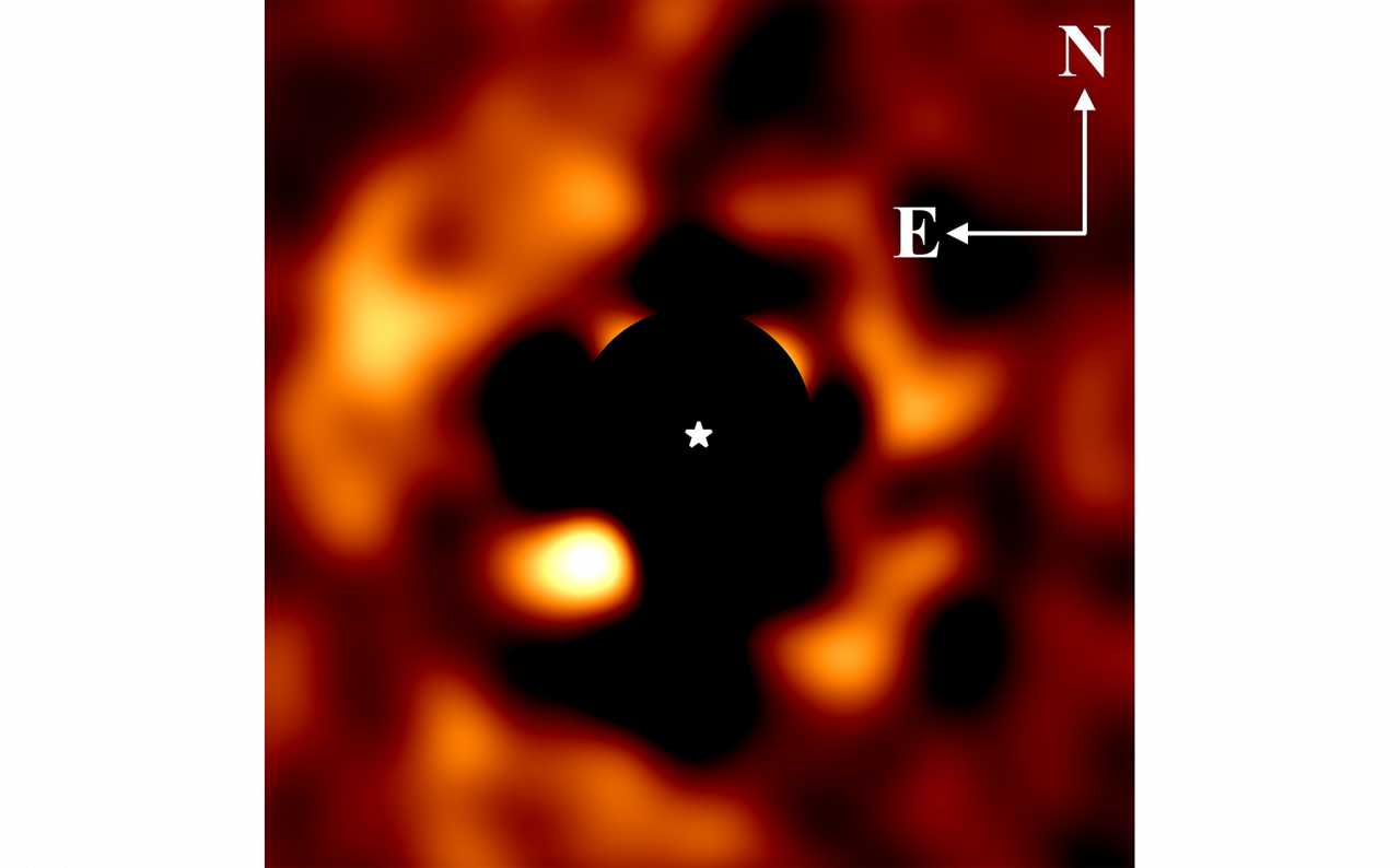 The first image captured by the Hubble Space Telescope of the newborn exoplanet PDS70b, orbiting a young star approximately 370 light years away from Earth.