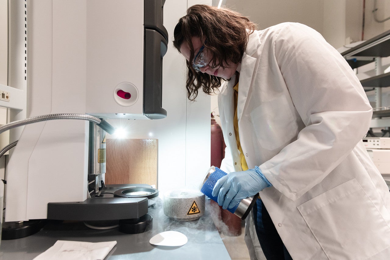 A graduate student working in the Sauer Structural Biology Lab