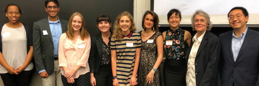 Several students and presenters smile